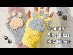 two crochet fingerless paw gloves are shown with paws on the top and bottom