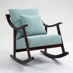 a blue rocking chair with two pillows on it's back and armrests