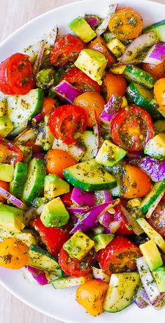 a white plate topped with lots of veggies