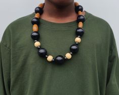 Wood Bead Chain / Wooden Bead Necklace - Bead Jewelry - Beads  This 30 inch long handmade wooden bead necklace is a pull over the head necklace with no clasp or closure at the back.  Black, Brown and Beige beads make up this African/Caribbean style bead chain that hangs about 13 inches long. Chunky Black Wood Bead Necklace, Wooden Bead Necklace, Style Africain, Jewelry Big, African Accessories, Caribbean Style, Head Necklace, Wooden Bead Necklaces, Necklace Bead