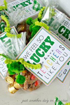 four bags filled with lucky charms on top of a table