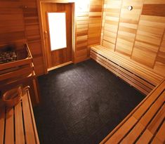 a wooden sauna with two benches next to it