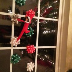 the cat in the hat door decoration is decorated with red and green bowknots