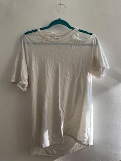 Vintage plain white threadbare thrashed t-shirt with rips and holes. Size medium. 100% cotton. Distressed White Short Sleeve T-shirt, White Distressed Short Sleeve T-shirt, Distressed White T-shirt For Spring, White Ripped Tops For Spring, White Distressed Short Sleeve Tops, White Distressed Crew Neck Top, White Distressed Relaxed Fit T-shirt, Ripped Cotton Short Sleeve T-shirt, Ripped Cotton T-shirt With Short Sleeves