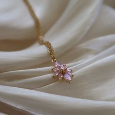 Pink Lotus Necklace, Flower Necklace, Gift for Her, Cubic Zirconia Jewelry, Lotus Necklace, Sparkly Necklace, Christmas Gift, Minimalist ☽ 18K Gold Plated, Pink Cubic Zirconia Charm (19.7x12mm) ☽ This is a gold plated charm meaning that it requires extra care to keep its shine and color intact. Please follow these tips to make the charm last longer in its original condition: avoid wearing it to the beach, pool, shower, bathtub, hot tub; avoid it touching any lotions, creams, or sweat; take it of Pink Flower Necklace, Dainty Choker Necklace, Sparkly Necklace, Lotus Necklace, Pink Lotus, Cubic Zirconia Jewelry, Jewelry Essentials, Fancy Jewellery, Girly Jewelry