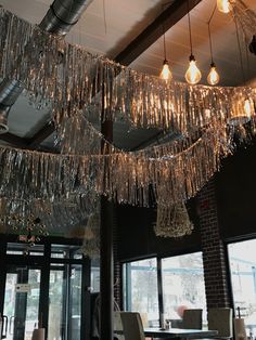 the chandeliers are hanging from the ceiling in the restaurant's dining room