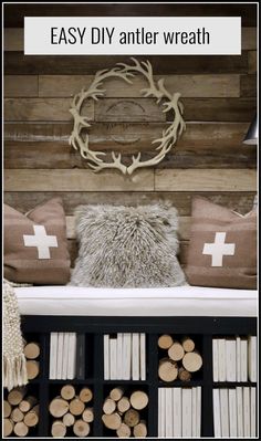 an easy diy antler wreath made out of wood logs and some faux pillows