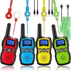 four children's walkie talkies are lined up in different colors and designs