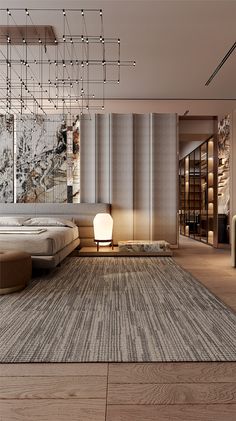 a modern bedroom with a large rug and chandelier hanging from the ceiling above it