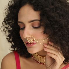 Description: Ogan Kundan nose ring from our bridal accessory catalog feature Kundan studded nose ring to amp up your bridal shower look. The alluring pearl details along with semi-precious beads make you look queenly and elegant to catch the eye. Based on a gold-plated base this is a perfect choice for your wedding trousseau. Details & Specifications: Materials used: Brass Alloy with Matte Gold Plating Weight - Nose Ring 9 gm, Length - Nose Ring 21 cm, Make it custom Want to make it a custom Nos Custom Nose Ring, Wedding Trousseau, Indian Natural Beauty, India Wedding, Bridal Accessory, Pearl Details, Precious Beads, Reference Pictures, Unique Accessories