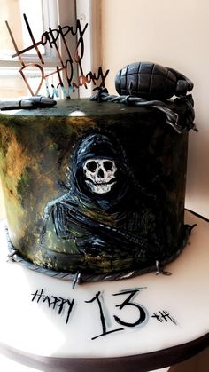 a birthday cake with a skeleton on it