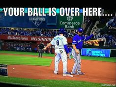 two baseball players giving each other a high five