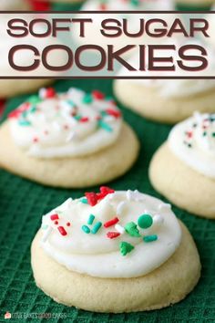 soft sugar cookies with white frosting and sprinkles on a green tray