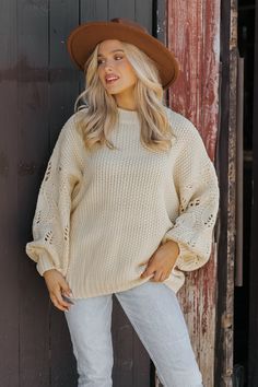 This Crochet Sleeve Pullover Sweater in Cream offers a chic blend of texture and style! Featuring long balloon sleeves with intricate crochet detailing, this sweater adds a unique flair to any outfit. It has a round neckline with ribbed detailing at the neckline, cuffs, and hem, enhancing its cozy feel. Designed with an oversized fit, it's perfect for layering and everyday comfort. Style with jeans, ankle booties, and a wide brim hat for an elevated chic outfit. Revival Clothing, Fall Style Guide, Intricate Crochet, Gameday Dress, Loungewear Dresses, Casual White Dress, Game Dresses, Chic Outfit, Wide Brimmed Hats