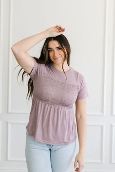 Introducing the Dana Top: its sweet lavender hue and soft fabric make it a dream to wear! Look no further for a top that's both stylish and comfortable, with smocked detail in the bust area and short sleeves for a touch of detail. Look luxurious and feel comfortable in the Dana Top! Model is wearing a size small and is 5'7". Plus model is wearing a size 1X and is 5'8". Size Chart Length Bust S 23" 30" M 23.5" 32" L 24" 34" 1x 26.5" 41" 2x 27" 46" 3x 27" 49" *All measurements are approximate and Plus Model, Hanging Fabric, Top Model, A Dream, Soft Fabric, Soft Fabrics, Lavender, Product Description, Short Sleeves