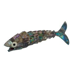 a metal fish with multicolored shells on it's body