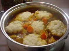 a pot filled with meat and vegetables on top of a stove