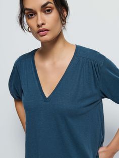 Not your boyfriend's v-neck. Shirred cuffs and front and back yoke give it that relaxed vibe, with a subtle balloon sleeve for a feminine twist. (This one comes in Midnight Navy). | Edie Top in Midnight Navy | Ethical Essentials V-neck Top For Daywear In Fall, Effortless V-neck Top For Daywear, Chic Relaxed Fit V-neck Top, V-neck Top For Fall Daywear, Relaxed Fit V-neck Top For Everyday, Midnight Navy, Shoulder Top, Twist, V Neck