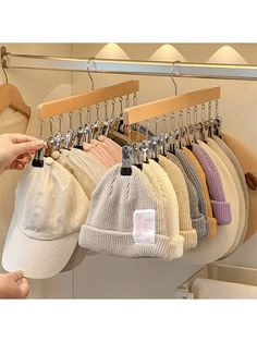 a rack with hats hanging from it's hooks