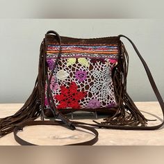 Rare Find, Very Cute Retro Style Floral Crochet Pattern, Beads & Leather Crossbody Bag By Streets Ahead. Made In Los Angeles, California, Of Italian Leather. Approximate Measurements: 8" X 9" X 1.5" Strap Adjusts From Approximately 47" To 53" (23.5" - 26.5") Outside Back Zip Pocket Inside Is Suede Lined With 1 Flat Pocket 7" Fringe Down Sides Of Bag Magnetic Closure I Did Confirm With Michelle Of Streets Ahead That This Is One Of Their Bags, Which Was Probably Made In 2011 - 2012. See Last Photo Brown Crochet Festival Bag, Brown Bohemian Crochet Bag For Festivals, Floral Crochet Pattern, Hippie Bags, Floral Crochet, Bead Leather, Magnetic Closure, Italian Leather, Leather Crossbody Bag