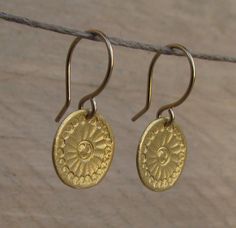 "Beautiful handmade gold Mandala flower discs swing from gold filled ear wires. ❉ F A C T S total length from top of ear wire: 1\" /2.5 cm disc: 0.5\"/ 1.3 cm diameter You will receive this Mandala Jewelry in a gift box, with an inspiring card, ready to be given as an empowering gift. Your earrings may vary slightly from the ones in the picture. Each pair is handmade to order. Feel free to contact me for any custom request : http://www.etsy.com/convo_new.php?to_username=ravitschwartz This design Adjustable Gold Round Flower Earrings, Gold Dangle Flower Earrings With French Hook, Gold Round Flower Earrings With Ear Wire, Gold Round Flower Earrings For Everyday, Handmade Gold Flower Earrings For Everyday, Mandala Jewelry, Mandala Earrings, Mandala Necklace, Gold Disc Necklace