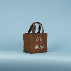 ALL SALES FINAL | NO RETURNS OR EXCHANGES ACCEPTED A High Quality, Lightweight Yet Durable Mini Tote Bag by WOLFpak. This Tote Bag Is Extremely Practical For The Office, Gym, Beach and More! 10L Tote Bag 10.5in (27cm) W x 9in (23cm) H x 5.5in (14cm) D Waterproof Surface Oxford 1000D Polyester Dual Exterior Side Pockets Hand Carrying Straps or Over the Shoulder Branded Embroidery Logo Molle Webbing Easy Clean Polyurethane Lining Protective Inside Computer Sleeve 10in x 6in (Fits Small Tablet) Ins Brown Everyday Bags With Reinforced Handles, Casual Brown Bag With Reinforced Handles, Brown Bag With Double Reinforced Handles, Brown Tote Bag With Reinforced Handles, Brown Double Handle Bag With Reinforced Handles, Brown Bags With Reinforced Handles For Daily Use, Brown Shopping Bags With Reinforced Handles, Functional Everyday Lunch Bag With Top Carry Handle, Large Capacity Tote Lunch Bag For Outdoor