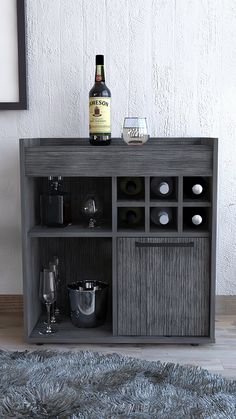 a bottle of wine sitting on top of a wooden cabinet