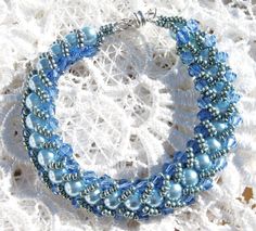 flat spiral Blue Pearl Bracelet With Spacer Beads, Blue Jubilee Crystal Bracelet With Round Beads, Blue Beaded Pearl Bracelet With Round Beads, Blue Beaded Pearl Bracelet, Spiral Bracelet, Beaded Braclets, Fredericksburg Va, Beaded Flats, Beading Ideas