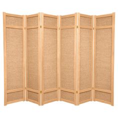 a room divider made out of wood and jute fabric, with four panels on each side