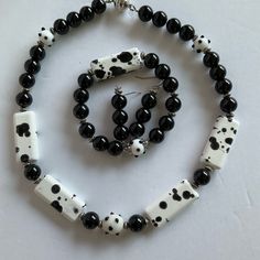 This Listing Is For A 3-Piece Set - A 20” Necklace, A 7.5” Stretch Bracelet And 1 7/8” Pierced Earrings. The Beads Are Black, Black And White With Silver Spacers And Findings. The Black And White Beads Are Cow Patch Design. A Statement Set Black And White Lovers, This Is For You. Cow Patch Lovers, This Is For You. Polka Dot Lovers, This Is For You. Handmade By Me. A Perfect Gift For Her Birthday Christmas Mother’s Day Anniversary Graduation Holiday Stunning Stop By My Closet (Mycreationsplus) Fo Unique White Jewelry With Black Beads, Adjustable White Jewelry With Black Beads, Adjustable Black And White Beaded Jewelry, Black And White Necklaces Beads, Black And White Necklaces Jewelry, Elegant Handmade Black And White Jewelry, Silver Multi-strand Necklace With Black Beads, Black Multi-strand Necklace With Faceted Beads, White Cow