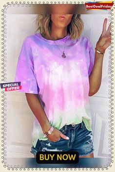 a woman wearing a purple and green tie dye t - shirt with the words buy now