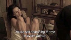 a woman sitting in a chair next to a mirror with the words you're still searching for me in every woman