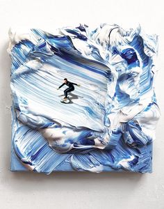 a painting with blue and white paint on it