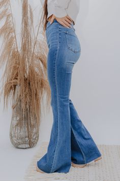 The Josie Jean RESTOCKED! The flares of flares! Turn heads in these FAB jeans! Medium Wash High Rise Super Bell Bottom Slim fit to the knee then flares below the knee No belt loops 33" Inseam 11 1/2" Rise 68% Cotton, 24%Modal, 7% Elasterell, 1% Spandex Fit is True to Size Kaylan is 5'6", wearing a 3" heel and is wearing the Size 3. Jimena (the last three pictures) is wearing the Size 5 (her true size). High Waisted Bell Bottom Jeans Outfits, Cute Bell Bottom Outfits, New Jeans Trend, Modest Jeans, High Waisted Bell Bottom Jeans, Bell Bottoms Jeans, Bell Bottom Jeans Outfit, High Wasted Jeans, Southern Outfits