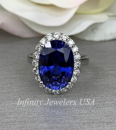 Elongated Oval Sapphire And Diamond Halo Style Engagement Wedding Anniversary Ladies Ring 14K White Gold #5656 #HolidayGift #DiamondRings #FashionRing #SapphireBirthstone #engagement #SeptemberBirthstone #HaloRings #LabCreatedSapphire #AnniversaryGift #ColoredGemstones Vintage Emerald Engagement Ring, Asscher Cut Engagement Rings, Large Stone Rings, Sapphire Birthstone, Blue Engagement Ring, Blue Sapphire Pendant, Elongated Oval, Sapphire Engagement Ring Blue, Halo Style