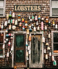 an old building with lots of lobsters hanging on it