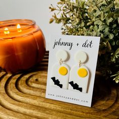 Get ready for spooky season with these fun white clay arched earrings! Featuring a cute black bat flying across a glowing yellow moon, they’re the perfect way to add some Halloween vibes to your outfit. Lightweight and comfy, they’re ideal for teachers or anyone who loves showing off their festive spirit. DETAILS: Measures 1 inch wide x 2 inches long Ultra Lightweight at just 1.5 ounce each Bat Flying, Yellow Moon, Halloween Vibes, Black Bat, Halloween Earrings, How To Show Love, White Clay, Moon Earrings, Everyday Earrings