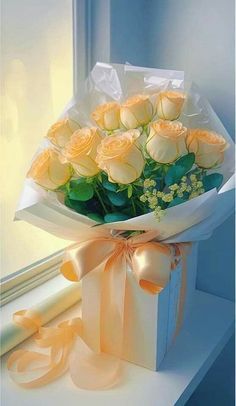 a bouquet of yellow roses sitting on top of a window sill next to a ribbon