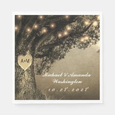 an elegant tree with lights is the centerpiece for this rustic wedding reception card, which features