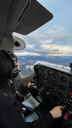 two pilots are in the cockpit of an airplane