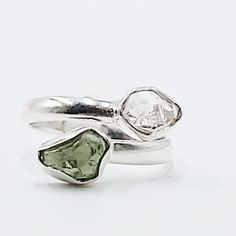 Divine Elegance Elevate your style with our exquisite Herkimer Diamond & Moldavite Ring, set in gleaming sterling silver. This stunning piece combines the celestial brilliance of Herkimer diamonds with the otherworldly energy of Moldavite, creating a ring that radiates elegance and power. Perfect for those who appreciate unique and spiritually significant jewelry, this ring is a true statement piece. Amplify Your Spiritual Journey Herkimer diamonds are renowned for their exceptional clarity and Moldavite Ring, Worry Stones, Herkimer Diamond, Tumbled Stones, Ring Sterling Silver, Spiritual Journey, Spiritual Growth, Stone Settings, Ring Set