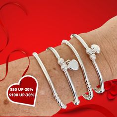 CHARMING SILVER BRACELET Thanks for choosing us ! We really want to make you happy! You can choose : * SS HEART CHARM & TUBES .... (CHARM) * PLAIN BAR ( CLASSIC SILVER 4MM) SET OF 2: (2 BRAC) * SS HEART CHARM & TUBES .... (CHARM) * PLAIN BAR ( CLASSIC SILVER 4MM) SET OF 4: (4 BRACELETS ) 2 OF SS HEART CHARM & TUBES .... (CHARM) 2 OF PLAIN BAR ( CLASSIC SILVER 4MM) 👍This Bracelet is perfect for stacking or just wear on its own. PRICE SHOWN IS FOR 1 HEART CHARM BRACELET ONLY* SHIPPING Silver Heart Bracelet For Birthday And Mother's Day, Silver Beaded Bracelet With Heart Beads, Silver Bangle Charm Bracelet For Valentine's Day, Silver Heart Beads Bracelet For Valentine's Day, Silver Beaded Bracelets For Mother's Day And Birthday Gifts, Valentine's Day Silver Beaded Bracelets With Round Beads, Valentine's Day Silver Beaded Bracelets, Silver Beaded Bracelets With Heart Beads For Gift, Silver Beads Bracelets For Valentine's Day