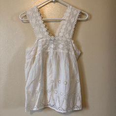 This Nwt. American Eagle Eyelet Tank Top Is Gorgeous. In Excellent Condition. Peasant Top. Chic White Crochet Top For Summer, White Sleeveless Crochet Top With Lace Trim, White Crochet Top For Day Out, White Crochet Top With Crochet Trim For Spring, Chic White Crochet Top For Spring, Chic White Crochet Top With Lace Trim, White Crochet Top With Lace Trim For Brunch, White Tank Top For Spring Brunch, White Tank Top For Brunch In Spring