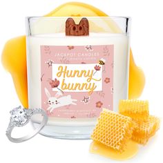 a candle and some honeycombs on a white background with the words happy bunny