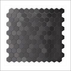 a black tile with hexagonal shapes on it