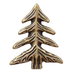 a metal christmas tree ornament on a white background