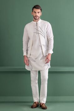 Ivory bundi with floral, bird embroidery. Paired with an inner kurta and aligadhi pant. - Aza Fashions Designer Cotton White Nehru Jacket, Designer White Cotton Nehru Jacket, White Cotton Nehru Jacket For Designer Wear, White Bandhgala For Spring Designer Wear, White Sherwani With Chikankari Embroidery For Spring, Spring White Sherwani With Chikankari Embroidery, White Cotton Sherwani For Spring, White Bandhgala With Floral Embroidery For Transitional Season, White Floral Embroidered Bandhgala For Transitional Season