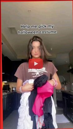 a woman holding a baby in her arms with the caption help me pick my halloween costume