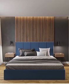 a large bed sitting in the middle of a bedroom next to a wooden headboard