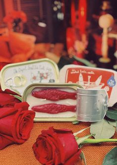 red roses and tins on a table